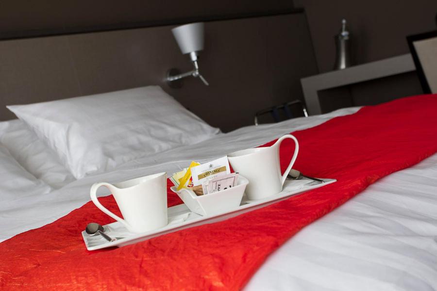 Postel nebo postele na pokoji v ubytování Zara Rooms & Suites