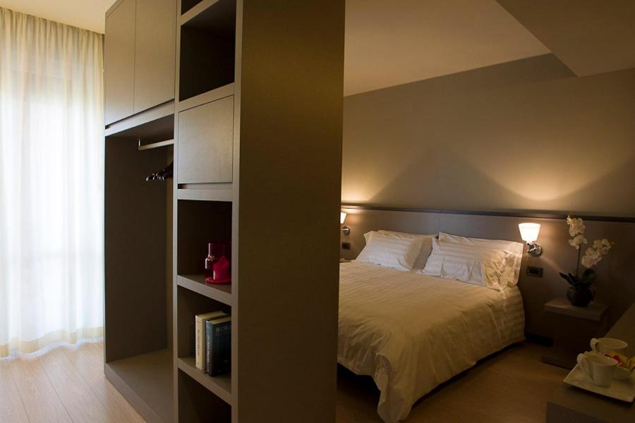 Postel nebo postele na pokoji v ubytování Zara Rooms & Suites
