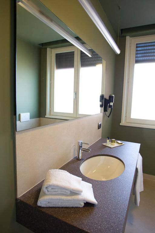 Fotografie z fotogalerie ubytování Zara Rooms & Suites v destinaci Suzzara
