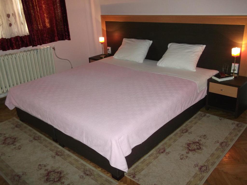 Postel nebo postele na pokoji v ubytování Vila Silia