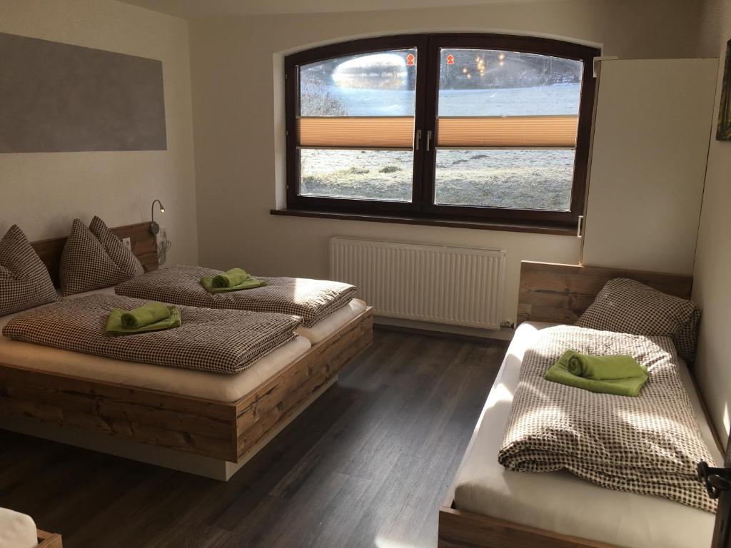 Postel nebo postele na pokoji v ubytování Haus Obertiefenbach