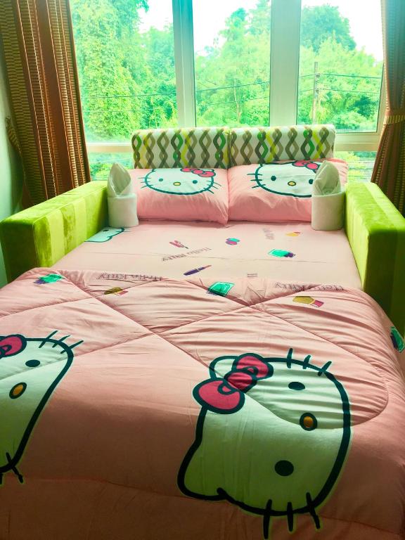 Postel nebo postele na pokoji v ubytování J.Holiday Inn Krabi