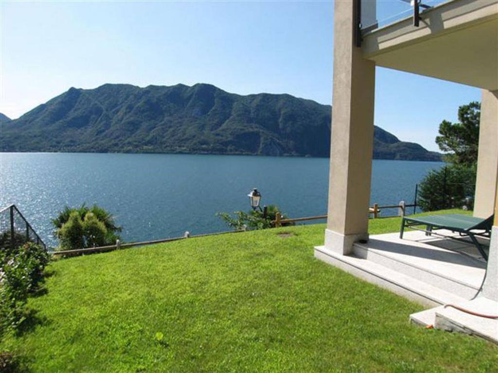 a house with a view of a body of water at Appartamento Cicci Bello in Ghiffa