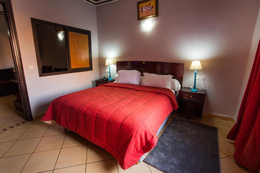 Postel nebo postele na pokoji v ubytování Residence Hotel Assounfou