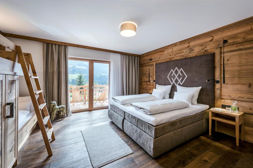Postel nebo postele na pokoji v ubytování Kaiserlodge
