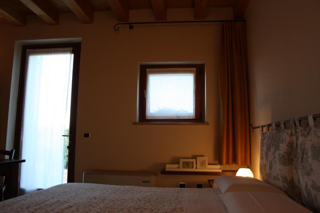 Postel nebo postele na pokoji v ubytování Agriturismo Al Barco