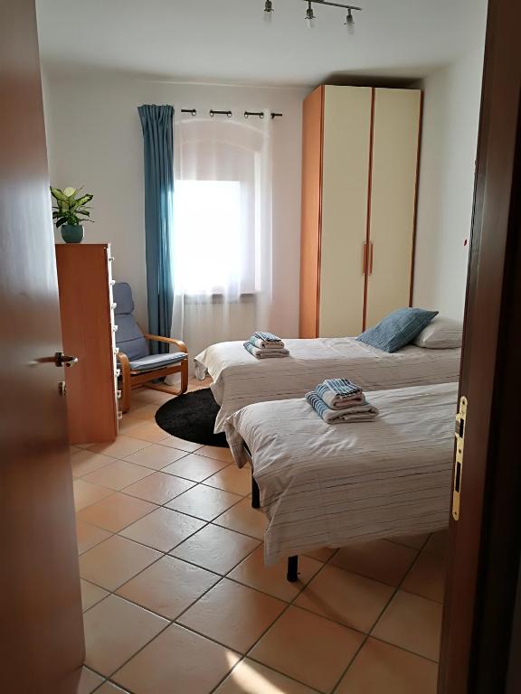 Posteľ alebo postele v izbe v ubytovaní B&B Pontesello