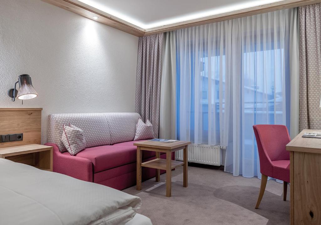 Posezení v ubytování Hotel Alpenland