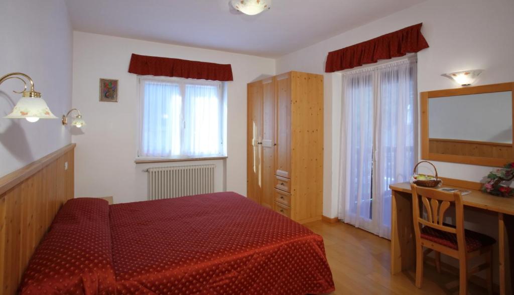 Postel nebo postele na pokoji v ubytování Hotel Zurigo