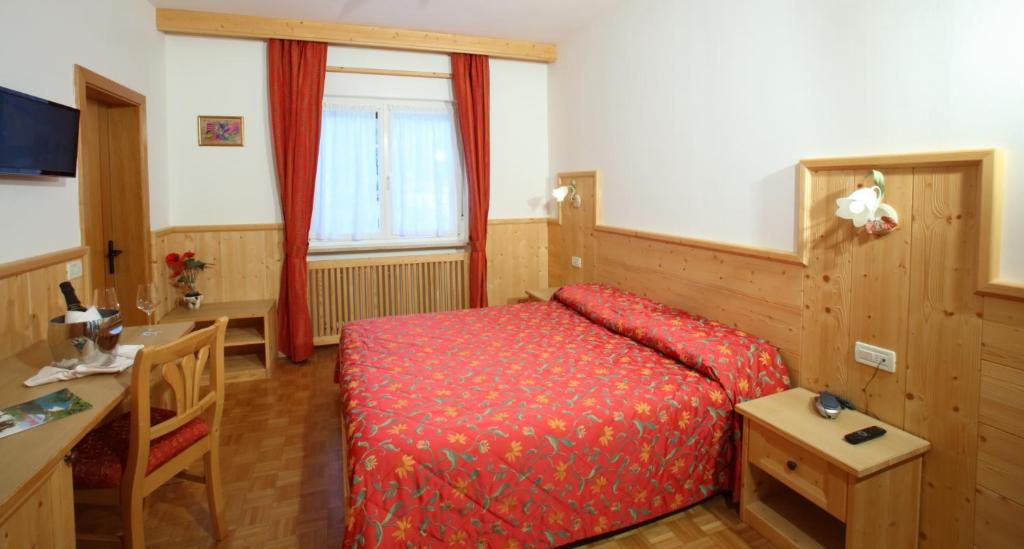 Postel nebo postele na pokoji v ubytování Hotel Zurigo