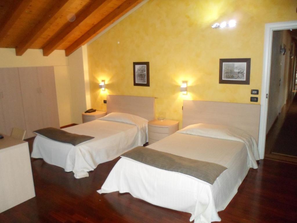 Postel nebo postele na pokoji v ubytování Hotel Fontana Santa