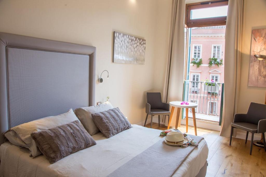 A bed or beds in a room at Antico Corso Charme