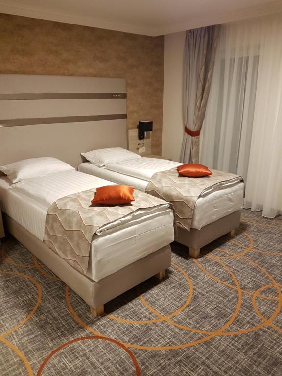 Postel nebo postele na pokoji v ubytování Hotel Baril