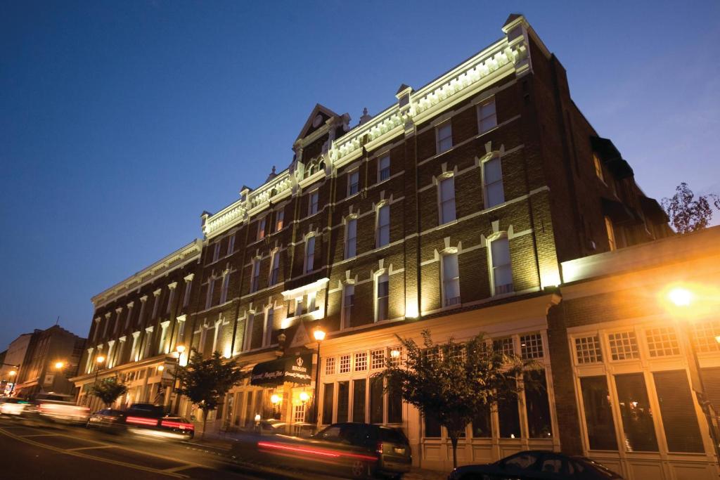a large building on a city street at night at General Morgan Inn in Greeneville