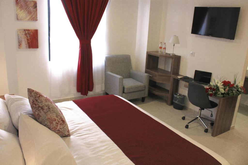 TV a/nebo společenská místnost v ubytování Astro Inn Hotel Express