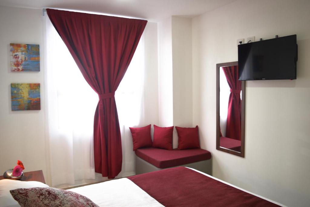 TV a/nebo společenská místnost v ubytování Astro Inn Hotel Express