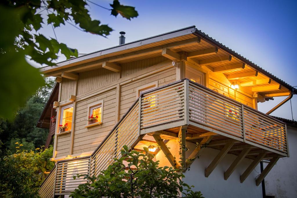 a tree house with a balcony on top of it at House Gabrijel with four seasons outdoor kitchen in Bled