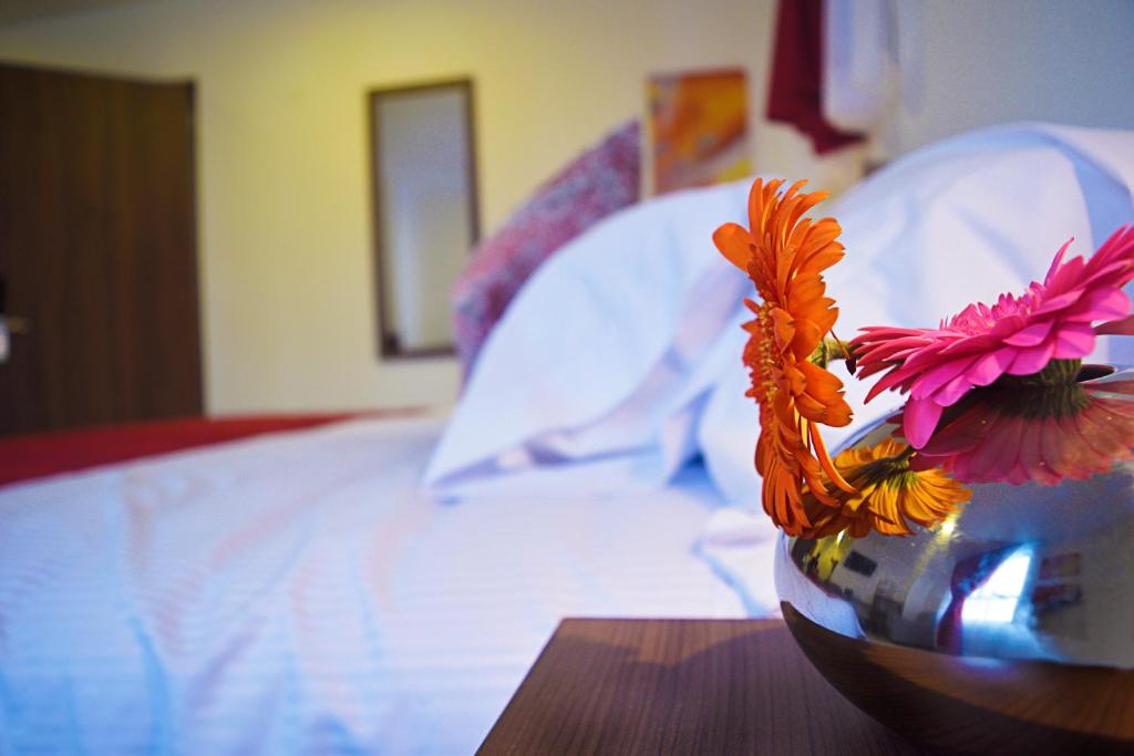 Postel nebo postele na pokoji v ubytování Astro Inn Hotel Express