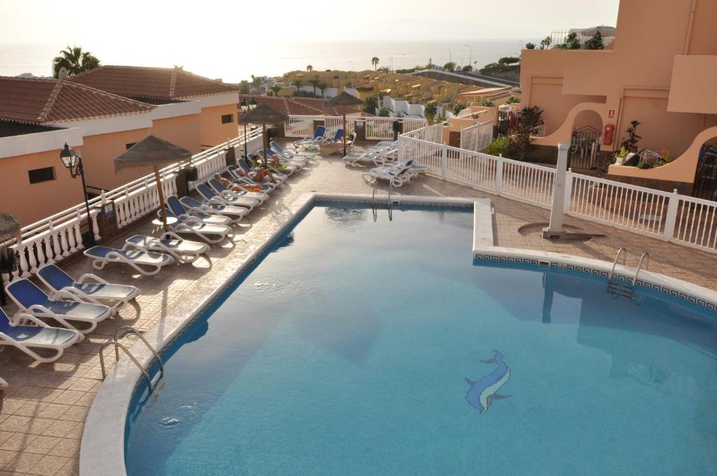Bazén v ubytovaní Paradise Court Las Americas WiFi Pool 25 alebo v jeho blízkosti