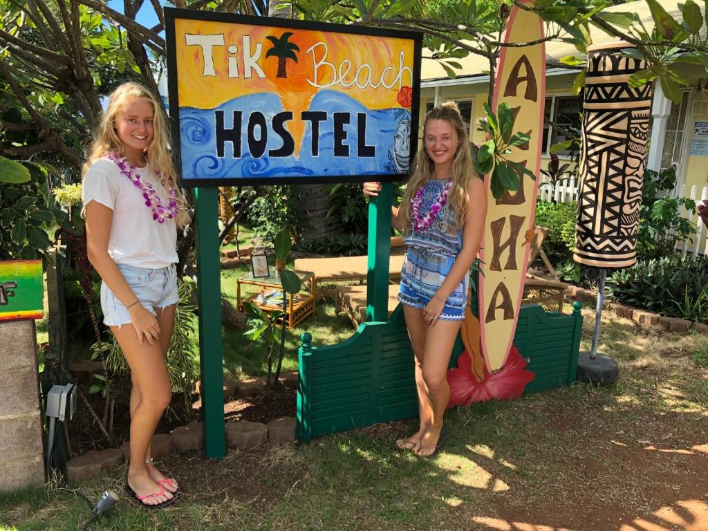 a woman and a man standing next to each other at Tiki Beach Hostel-At The Beach in Lahaina in Lahaina