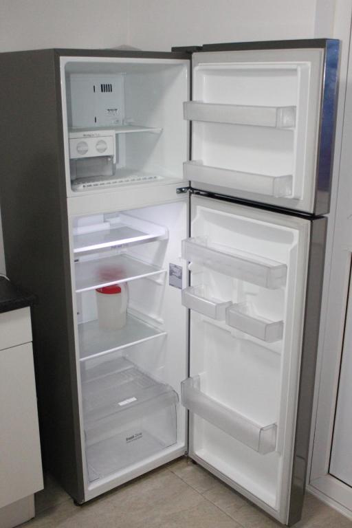 Kuchyň nebo kuchyňský kout v ubytování Genesis Apartments