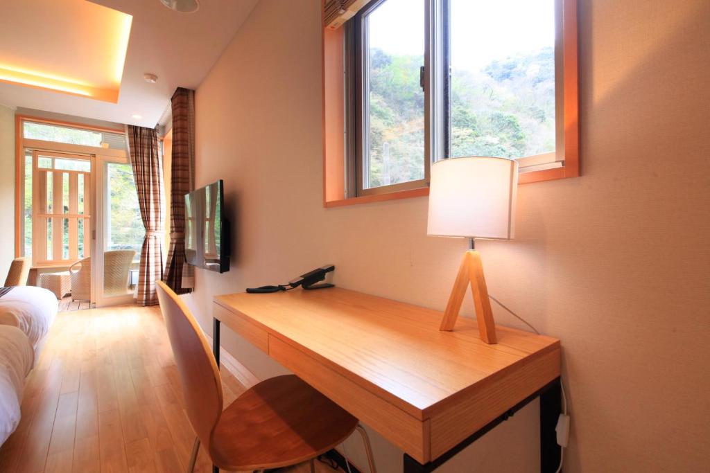 TV a/nebo společenská místnost v ubytování Hotel Okada