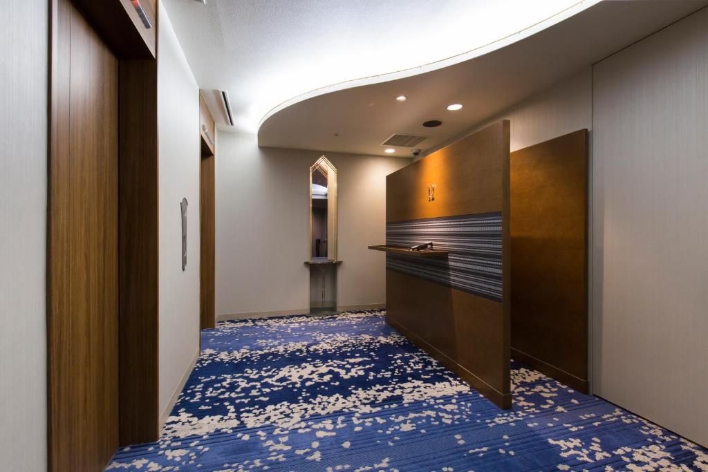 Postel nebo postele na pokoji v ubytování Hakata Excel Hotel Tokyu