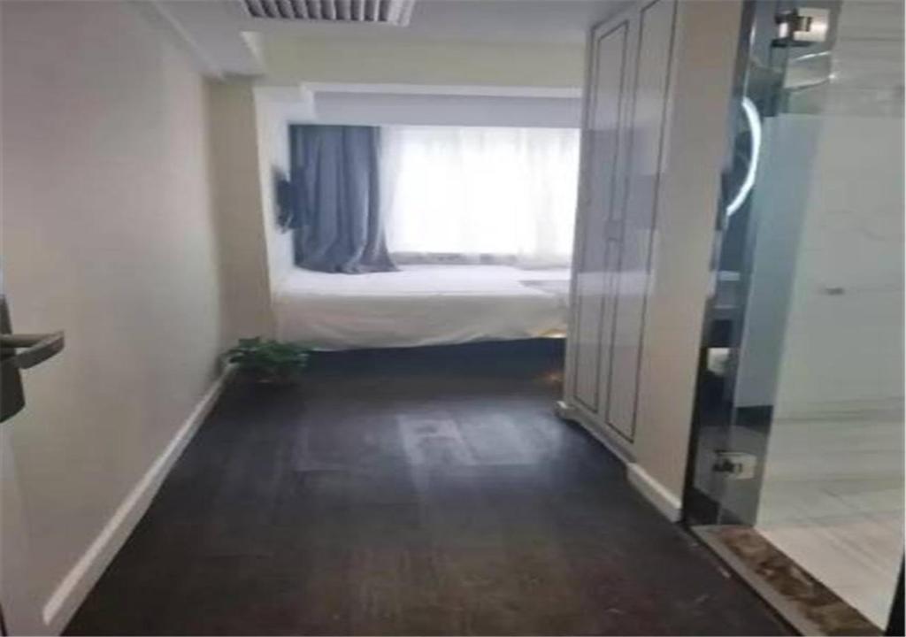 Postel nebo postele na pokoji v ubytování Xana Hotelle Beijing Tianqiao