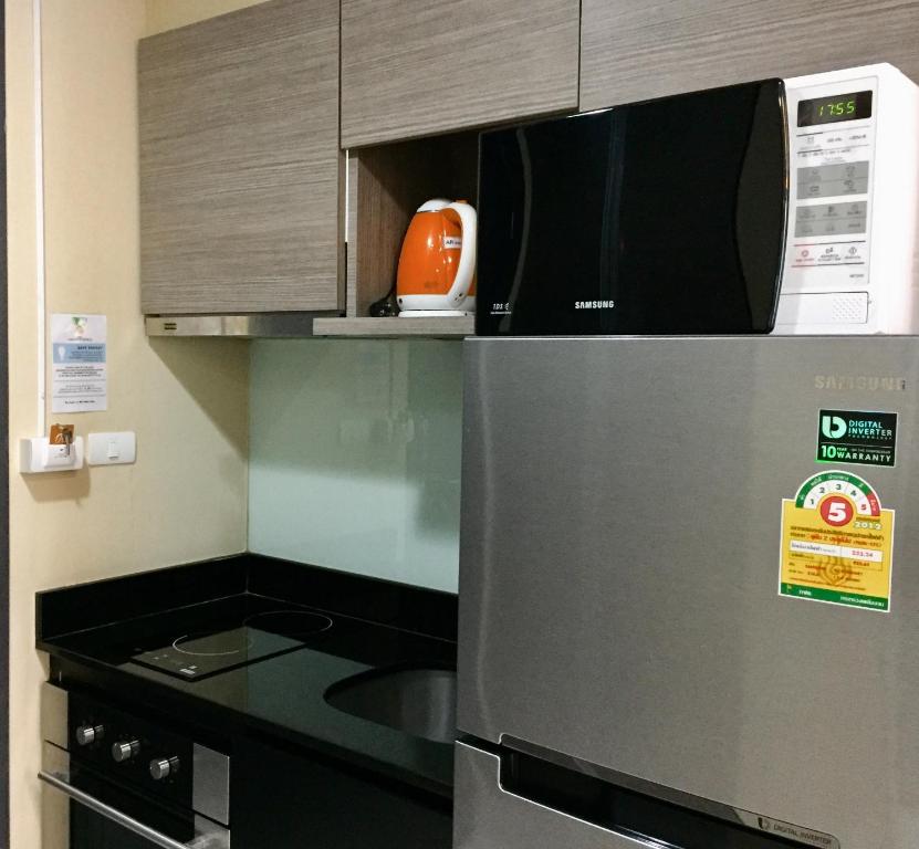 Kuchyň nebo kuchyňský kout v ubytování Avatar Suites Hotel - SHA Extra Plus