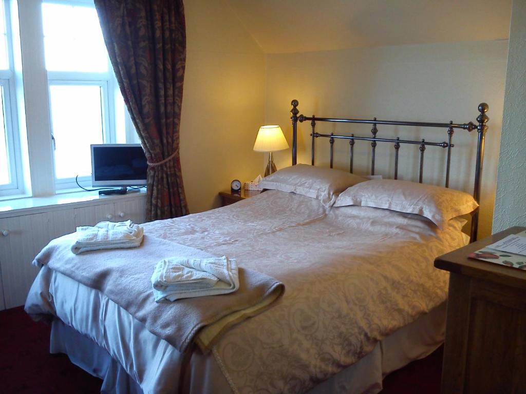 Postel nebo postele na pokoji v ubytování Dunivaig B&B