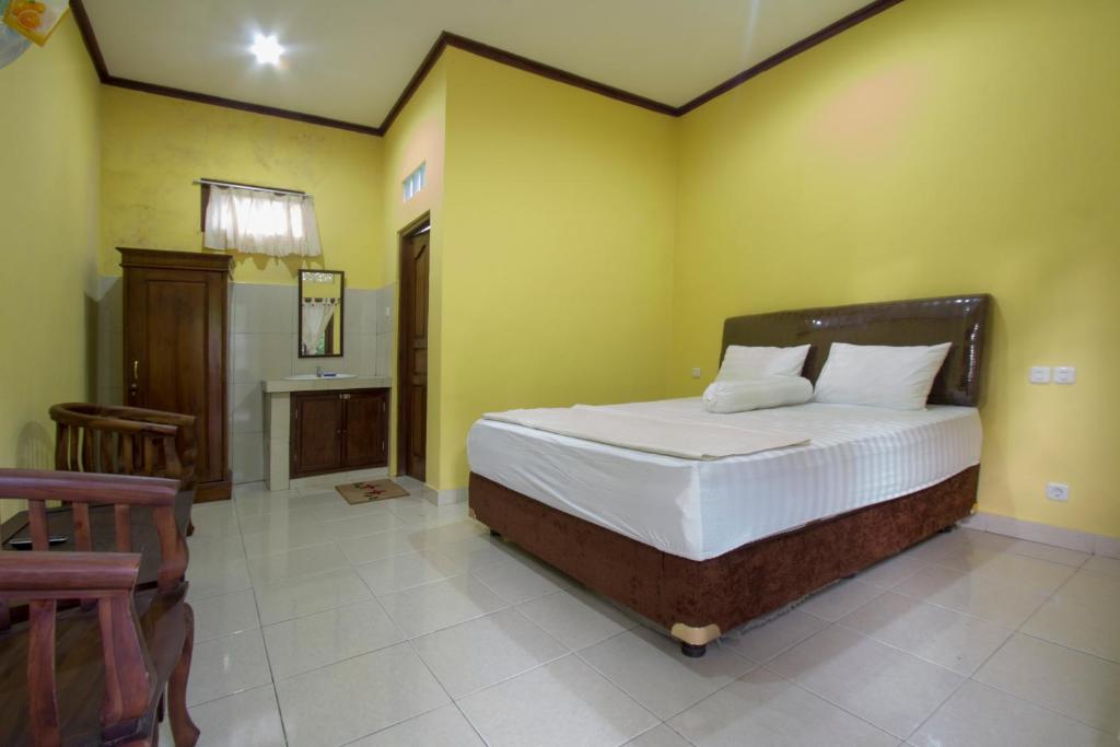 Postel nebo postele na pokoji v ubytování Nova Homestay Ubud