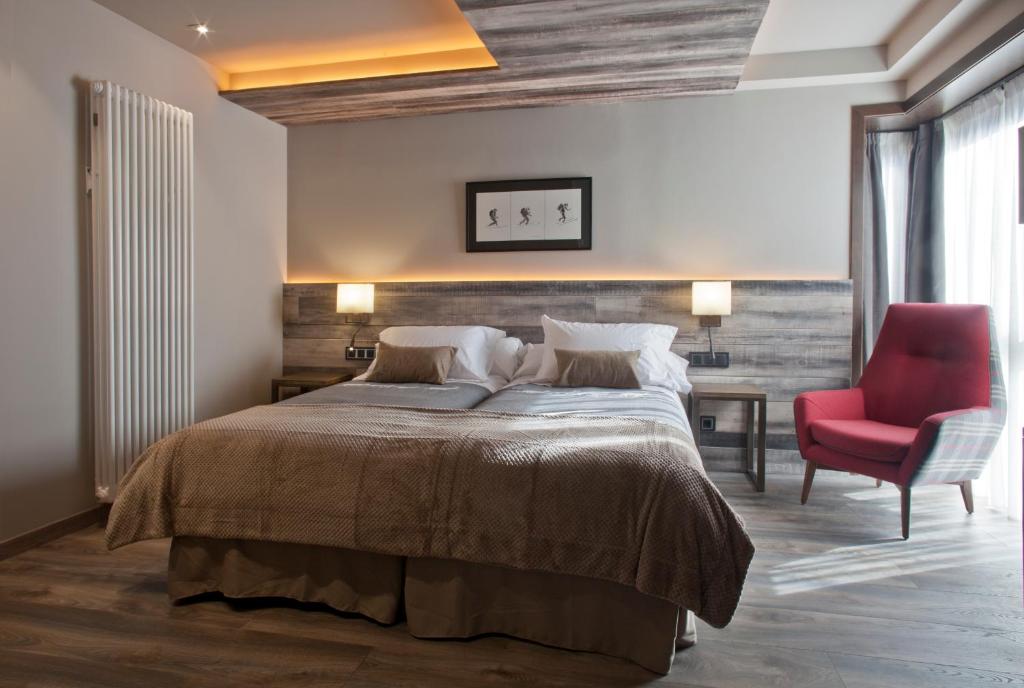 Postel nebo postele na pokoji v ubytování Hotel Boutique La Neu