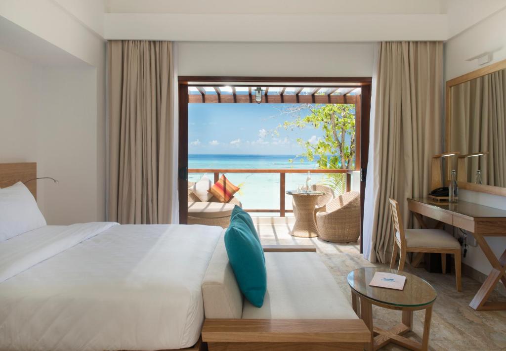 Postel nebo postele na pokoji v ubytování Summer Island Maldives Resort