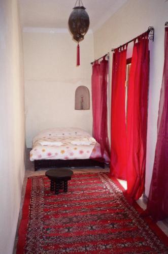 Postel nebo postele na pokoji v ubytování Riad Al Faras