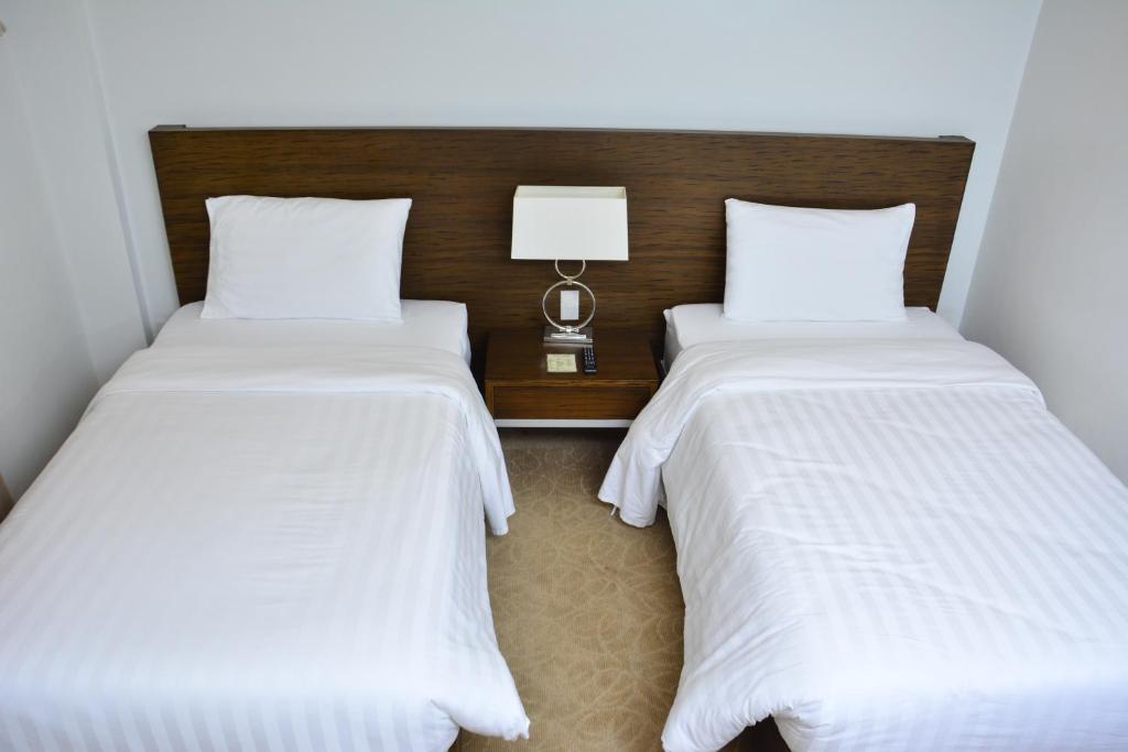 Postel nebo postele na pokoji v ubytování Top Star Hotel