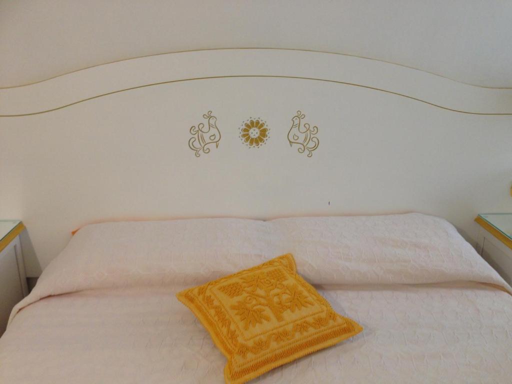 Postel nebo postele na pokoji v ubytování B&B da Miranna