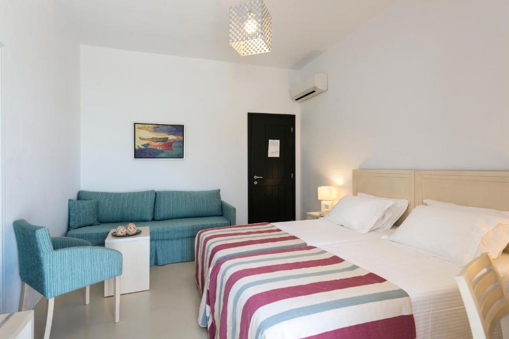 Postel nebo postele na pokoji v ubytování Kalypso Hotel
