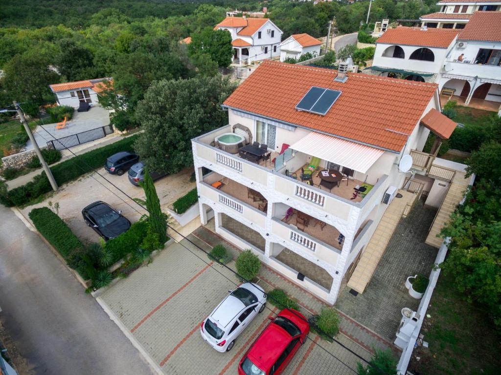 an overhead view of a house with a solar roof at Apartments Ruzica in Pinezici