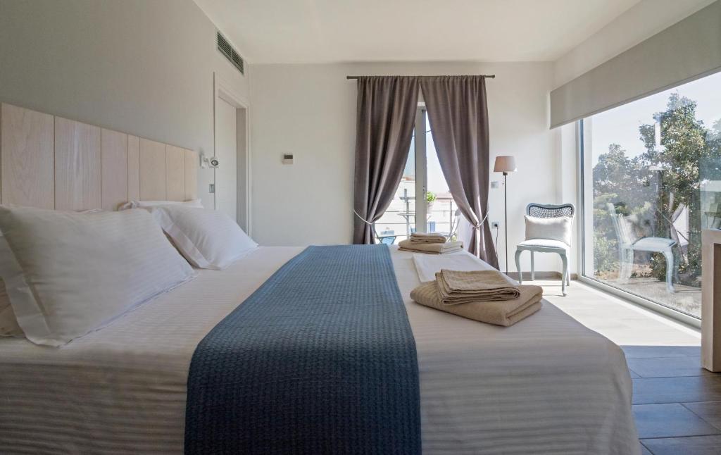 Postel nebo postele na pokoji v ubytování Lidea Boutique Hotel