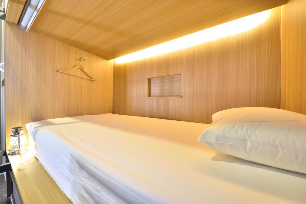 Postel nebo postele na pokoji v ubytování With U Hotel & Guesthouse