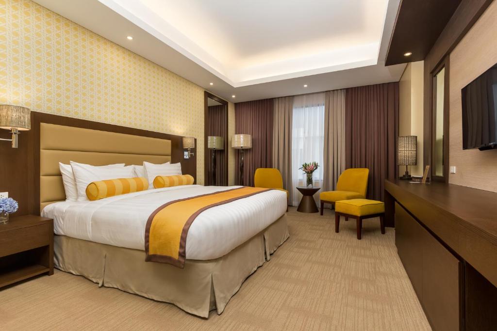 Postel nebo postele na pokoji v ubytování Maayo Hotel
