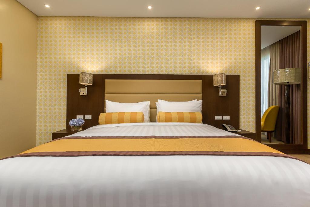 Postel nebo postele na pokoji v ubytování Maayo Hotel