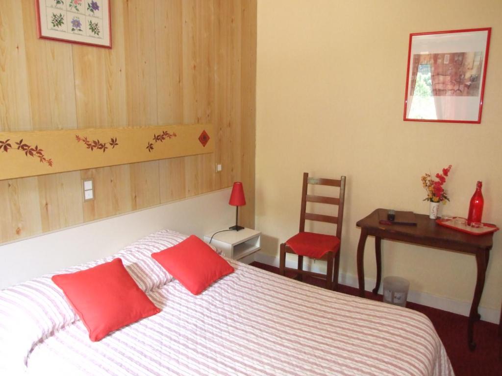 Voodi või voodid majutusasutuse Hôtel du Val d'Aure toas