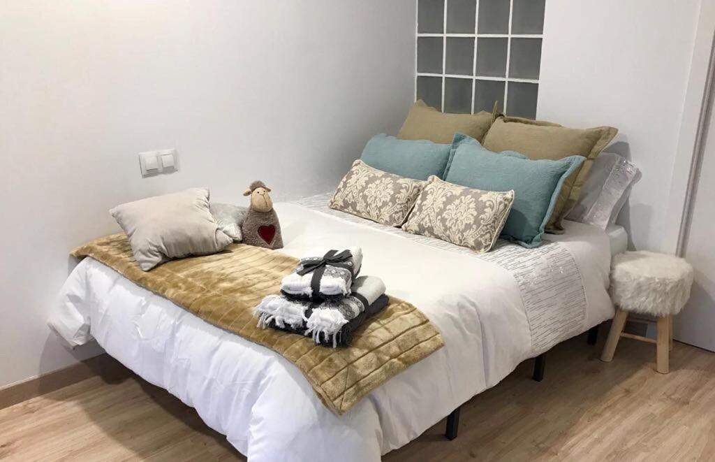 Un pat sau paturi într-o cameră la Apartamento