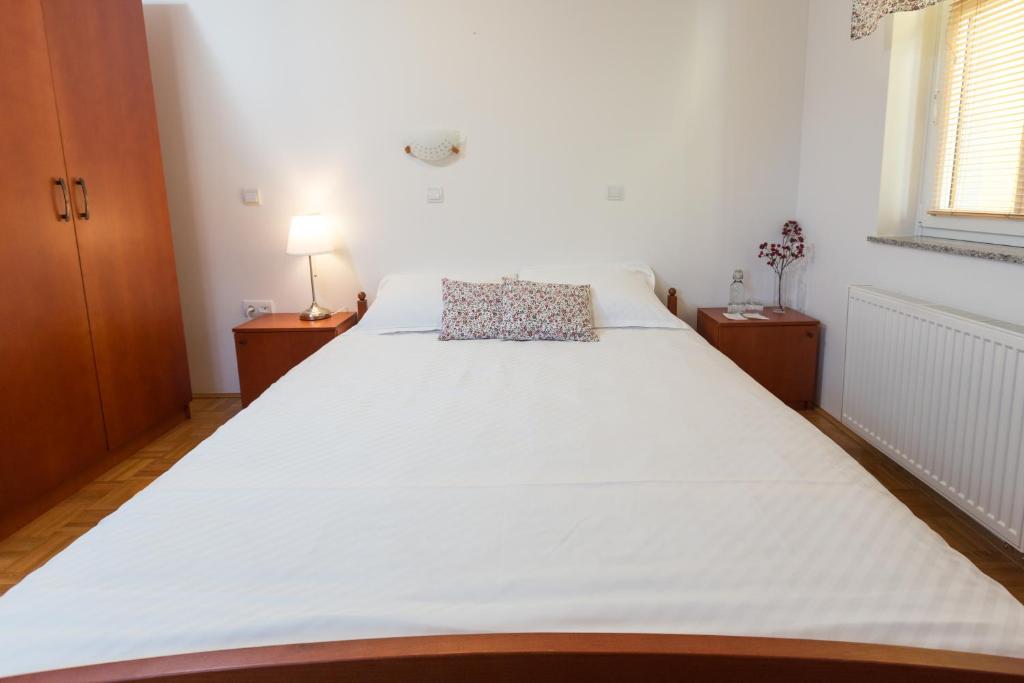 Postel nebo postele na pokoji v ubytování Guest House Pod Grebenom