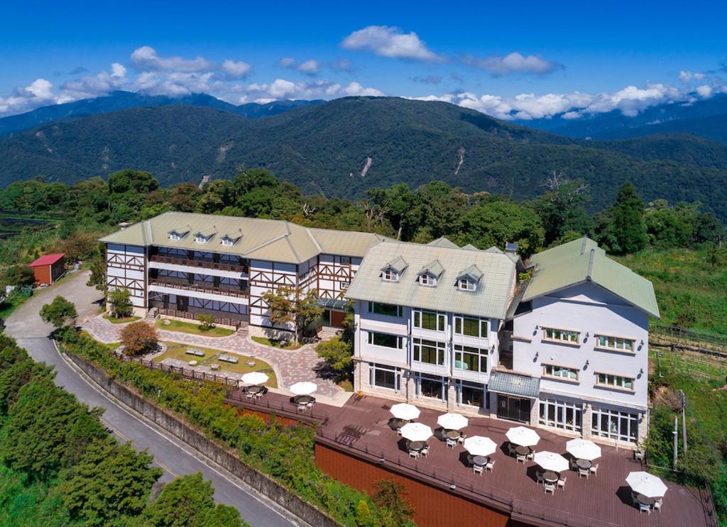 an aerial view of a hotel with mountains in the background at Jun Yue Hanging Garden Resort in Ren&#39;ai