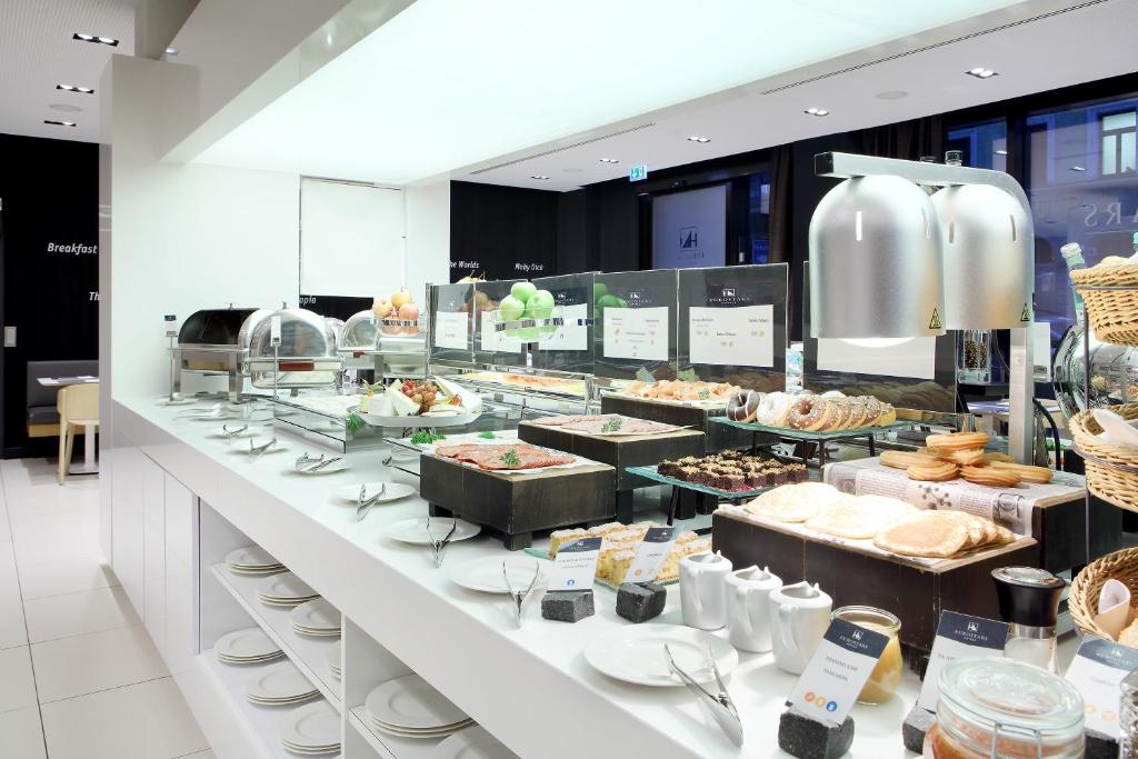 a buffet line with many different types of food at Eurostars Book Hotel in Munich