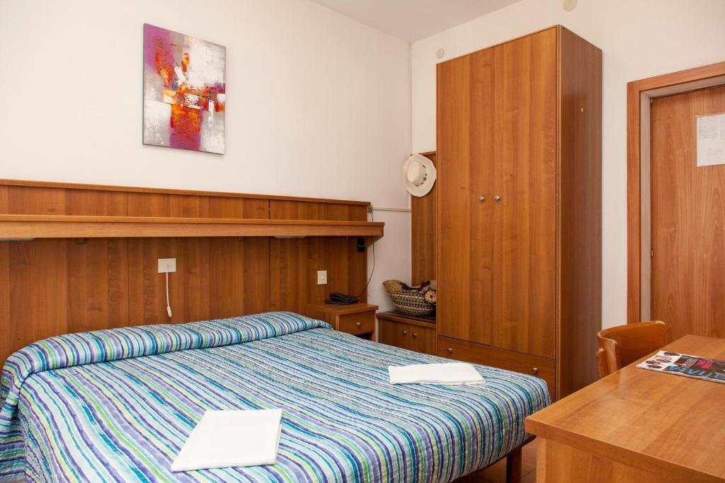 Posteľ alebo postele v izbe v ubytovaní Hotel Taormina