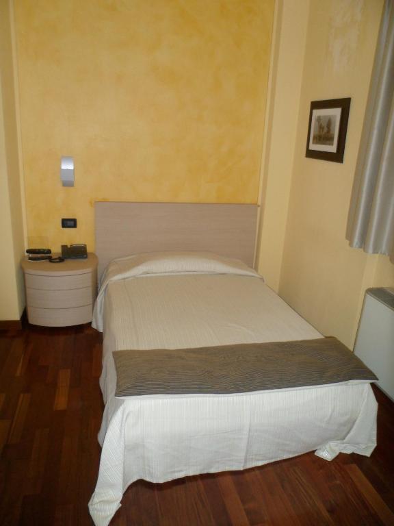 Postel nebo postele na pokoji v ubytování Hotel Fontana Santa