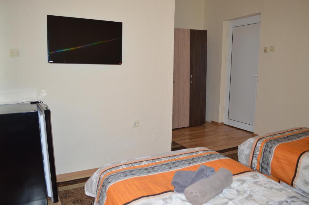 Postel nebo postele na pokoji v ubytování Dionis Hotel